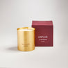 Unplug scented 100% natural wax candle 220g next to claret red candle box. Front