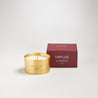 Unplug scented 100% natural wax candle 110g next to claret red candle box. Front